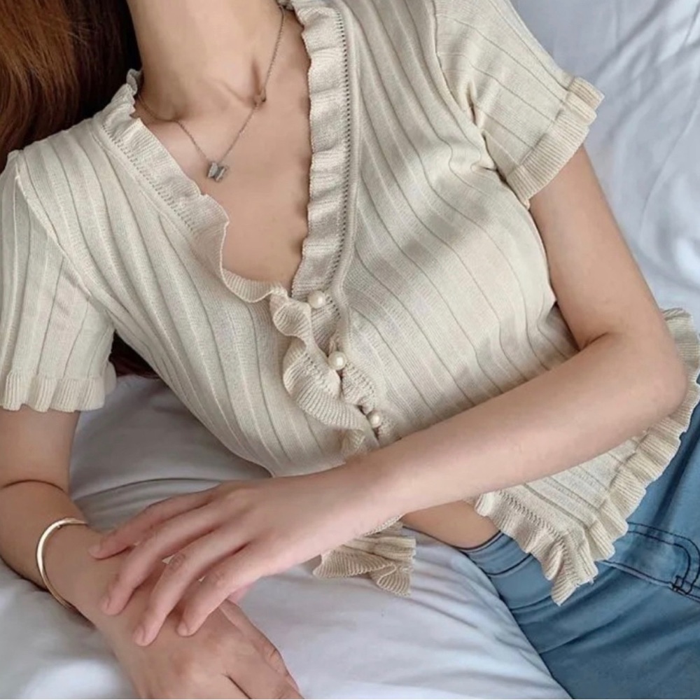 Beige/almond colored short sleeved cardigan